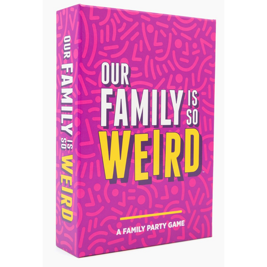 A bright pink box with abstract patterns displaying the title "Our Family is So Weird" in bold white and yellow text. A family party game.