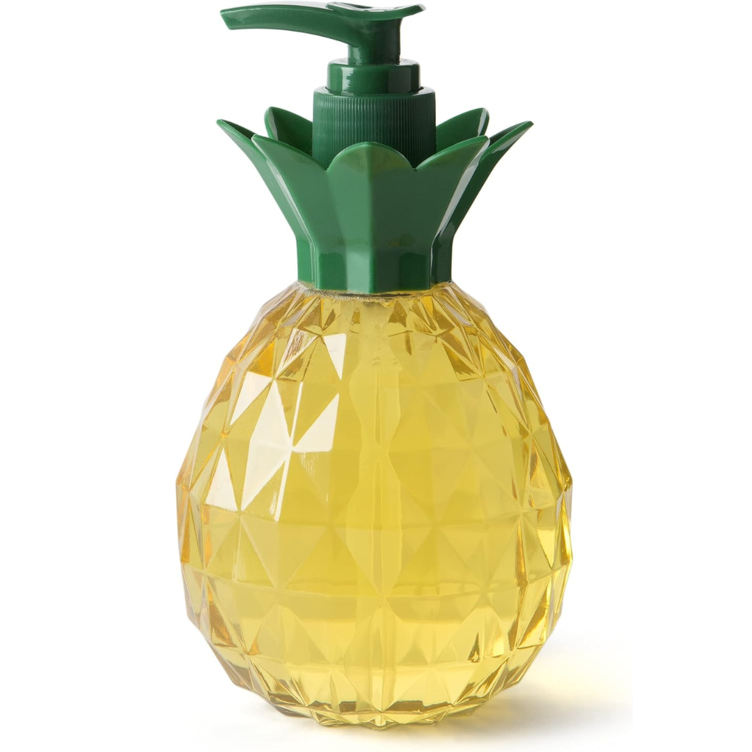  A pineapple-shaped soap dispenser with a faceted yellow body resembling a real pineapple and a green pump top designed to look like pineapple leaves. The dispenser is filled with yellow liquid soap, adding to its tropical aesthetic.