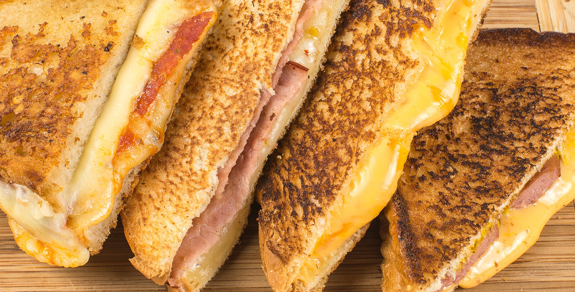 Close up view of 4 grilled cheese toasted sandwiches